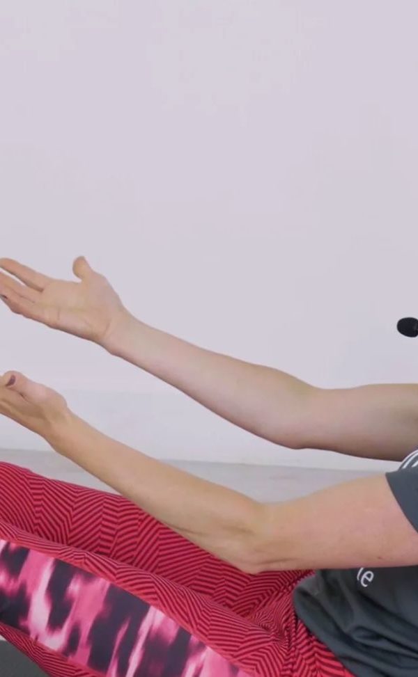 Woman, greay t-shirt, leopard print leggings, microphone head-set, talking, exercising