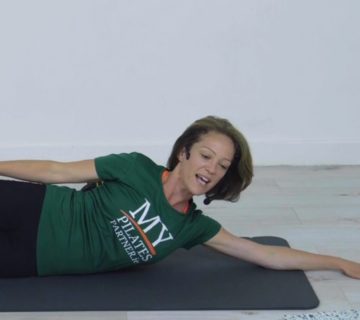 woman, green t-shirt, My Pilates Partner, exercising on mat