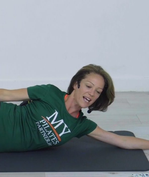 woman, green t-shirt, My Pilates Partner, exercising on mat
