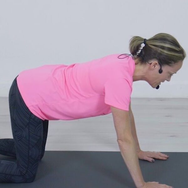 Woman kneeling in exercise position