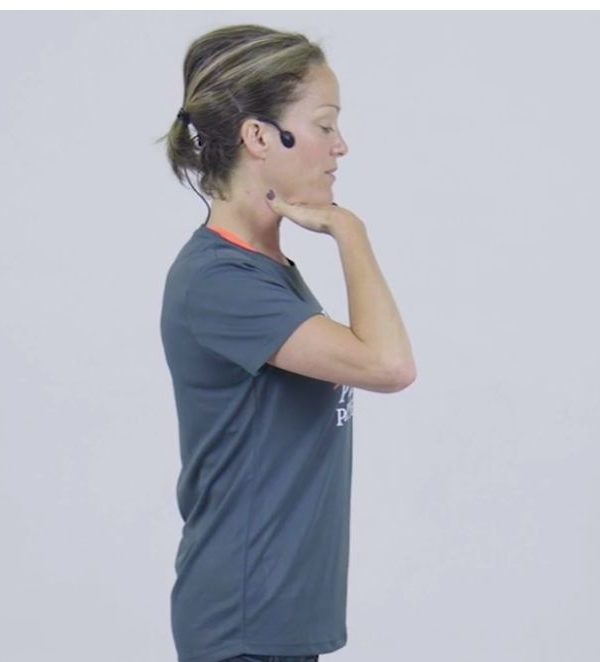 stand tall Pilates posture video grey t-shirt, headphones